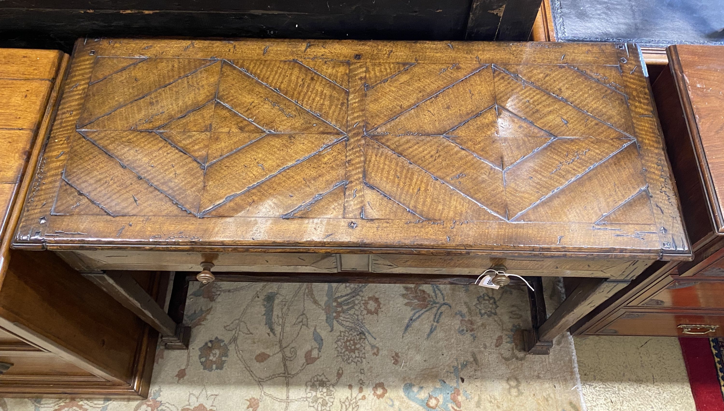 A reproduction oak side table, fitted two drawers, width 106cm, depth 43cm, height 80cm